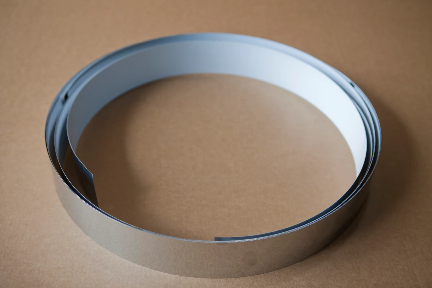 Rolling sheets or strips to a particular diameter